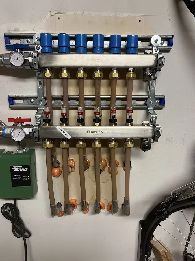 Plumber performing Water Heater Repair at a residential property in Bellevue